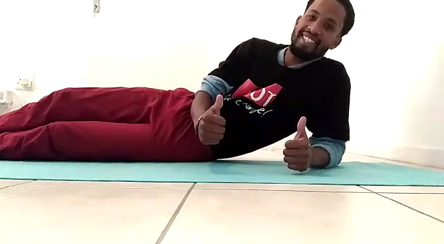 man doing the plank exercise and showing thumbs up